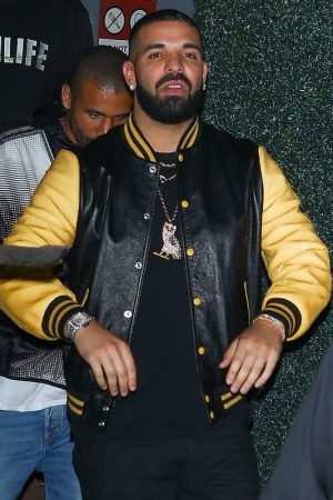 Musician Aubrey Drake Graham Wearing a Black Bomber Jacket which have yellow sleeves