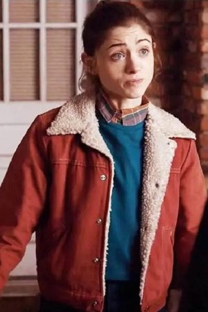 Nancy Wheeler Wearing blue top and Red Jacket in Stranger Things