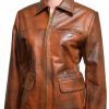 Yong Girl Wearing A Brown Leather Jacket In Film Series The Hunger Games as Katniss Everdeen