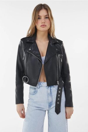 Young Girl Wearing A Black Leather Biker Jacket