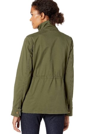 A Yong Girl Wearing A White Top and Outwear is Green Cotton Jacket