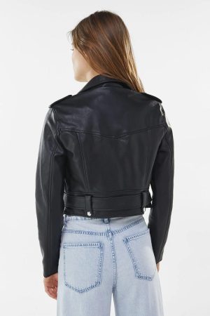 A Young Girl wearing A Biker Jacket in Black Color