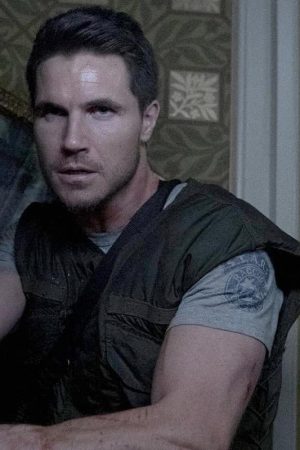 Robbie Amell Wearing Vest In Resident Evil: Welcome to Raccoon City as Chris Redfield