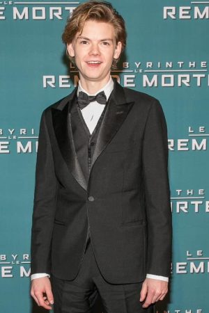 Thomas Brodie-Sangster at an event for Maze Runner The Death Cure Wearing Black Tuxedo suit