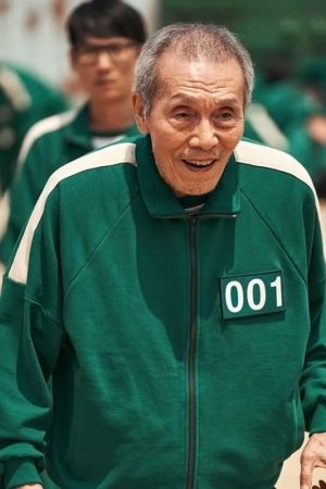 Actor Oh Yeong-su Wearing Green Jacket In Squid Game as Oh Il-nam